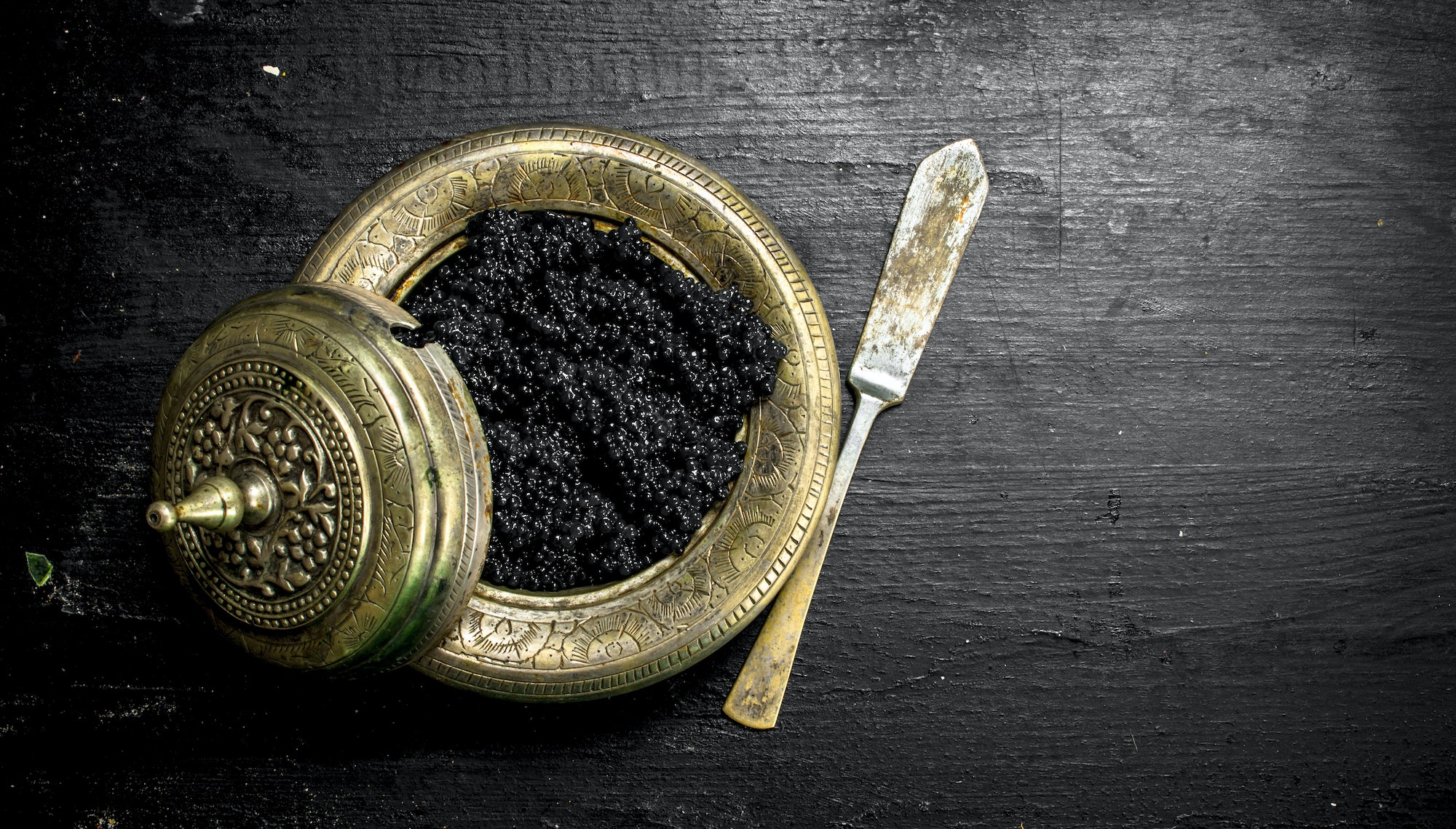 Black caviar in a bowl.